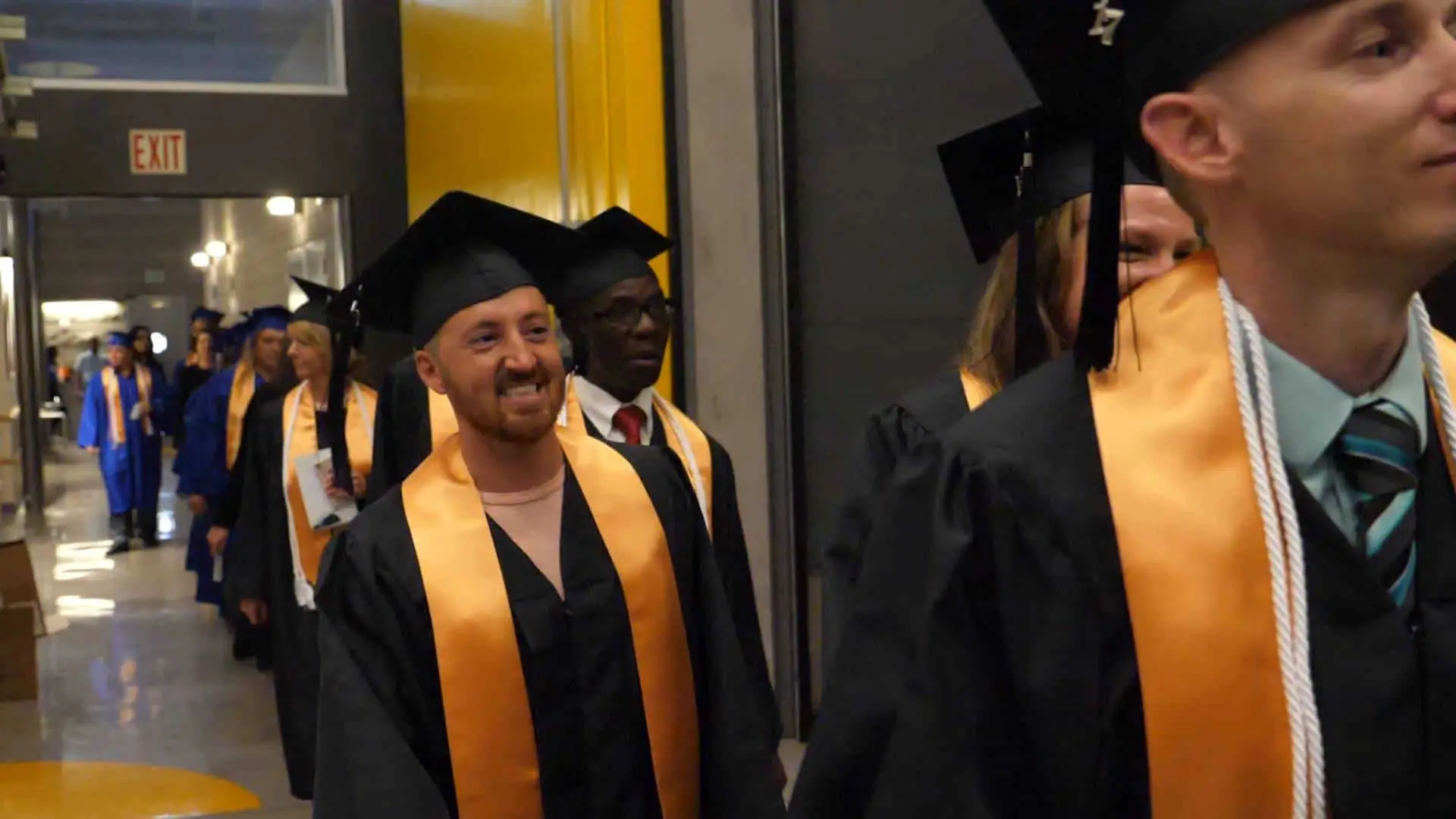 Bryan Univ Graduates walking