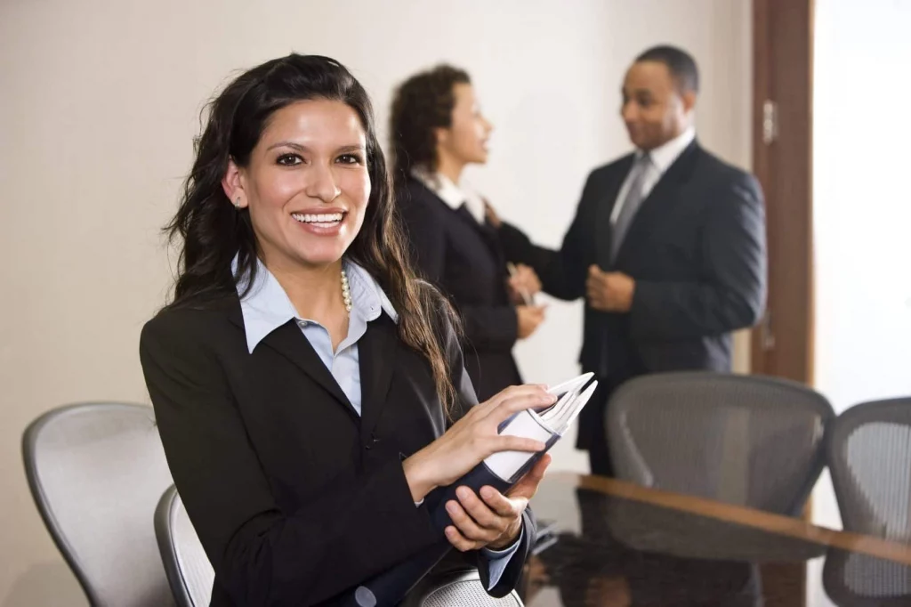 businesswoman in suite smiling