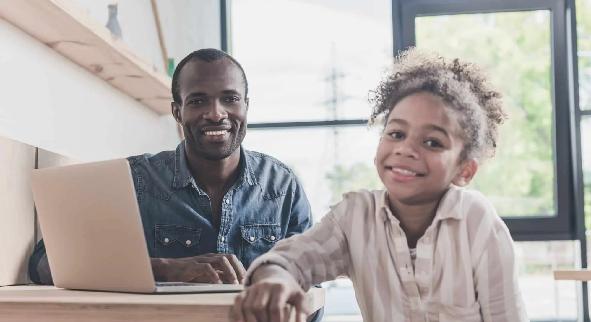 father and daughter smiling