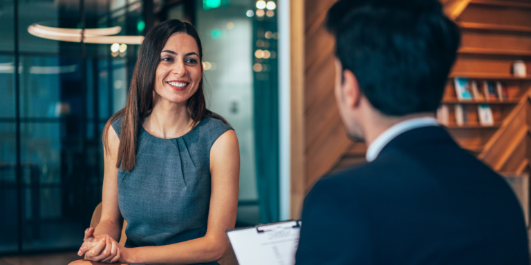 Office professionals at conference table