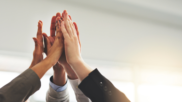 hands only shown in group high five