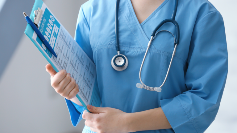 medical person holding clipboard|medical person holding clipboard