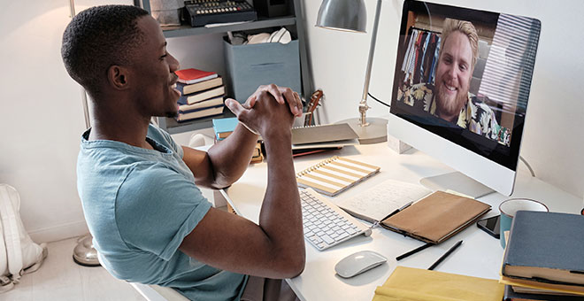 black man teaching over video chat class