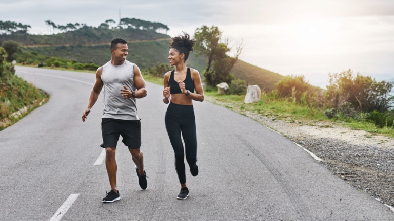 Two individuals running together